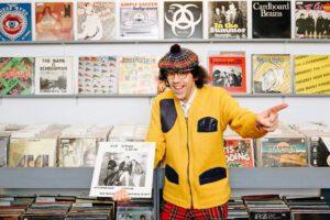 NARDWUAR poses with Get Loose CRew record for NOW Magazine Interview